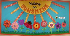 a bulletin board with flowers on it that says, walking on sunshine and the letters a to z