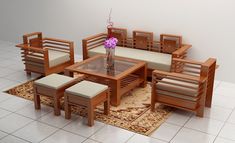 a dining room table and chairs are arranged on a rug