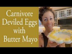 a woman holding a plate with deviled eggs on it and the words, cannivor deviled eggs with butter mayo