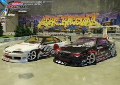 two racing cars parked next to each other in front of a graffiti covered wall with the word race on it