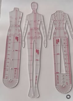 two paper dolls are shown in the shape of rulers and body shapes, one is cut out to look like a woman's figure