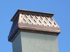 the top of a clock tower against a blue sky