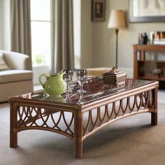 a coffee table that has some glasses on it