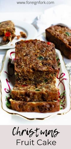 three pieces of fruit cake on a plate with the words christmas fruit cake above it