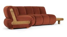 an orange couch with wooden legs and arm rest