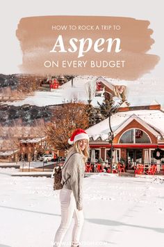 a woman standing in the snow wearing white pants and a santa hat with text overlay that reads how to rock a trip to aspen on every budget