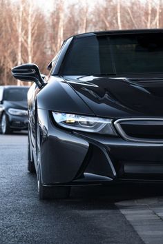 the front end of a black sports car