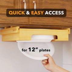 a person holding a plate under a kitchen cabinet with the words quick and easy access for 1 / 2 plates