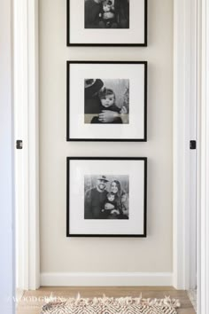 three black and white photos hang on the wall above a rug in front of two framed pictures