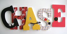 the letters are made out of wood and paper