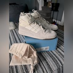 Nwb/Nwt: Adidas X Ivy Park Forum Mid Sneakers - Size 6 In Boys Which Are Size 8 In Women- Color Is Alumin/Cwhite/Gums (Exactly What It States On The Box) - They Come With A What I Think Is A Key Chain Of Some Sort, That Reads “Ivy Park” It Is Pictured- These Have A Sleek Look That Go With Everything! As We Know Adidas X Ivy Park Are No Longer Collaborating- Any Questions Please Ask! Adidas X Ivy Park, Mid Sneakers, Ivy Park, Adidas X, Sleek Look, Woman Colour, Adidas Women, Key Chain, Ivy