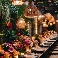 a long table is set with flowers and candles for an elegant dinner or party event