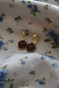 Wrap yourself in love with our Brown Heart Huggies! These delicate earrings are simply made to go with any outfit. These earrings are lightweight and comfortable for all-day wear. Size- 1.0 inch drop, Width 0.4 inches Materials - Zinc Alloy Cute Heart-shaped Earrings For Everyday Wear, Cute Everyday Heart Charm Earrings, Cute Heart-shaped Everyday Earrings, Cute Everyday Heart-shaped Earrings, Hypoallergenic Brown Hoop Earrings As Gift, Cute Everyday Earrings With Heart Charm, Heart Huggies, Chunky Jewellery, Brown Heart