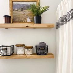 two shelves above a toilet in a bathroom