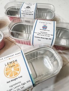 three containers of lemon yogurt sitting on a marble counter top next to each other