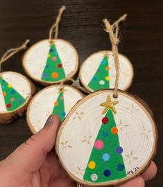 handmade christmas tree ornaments on wooden slices