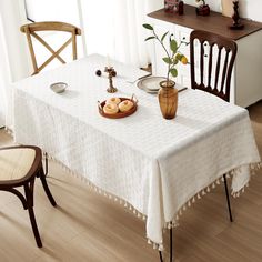 a white table cloth on a dining room table