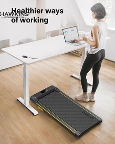 a woman standing in front of a desk with a laptop on it and the words healthier ways of working above her