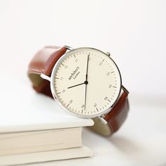 THIS ENGRAVED MEN'S LEATHER WATCH CAN BE PERSONALISED WITH STANDARD ENGRAVING OR YOUR OWN HANDWRITING! A beautiful gift for that special someone. Choose to have our modern font engraving or have your own handwriting engraved onto the back of this Men's Architect Zephyr with Walnut Strap. Sometimes less is more. We created a minimalist watch which is far from simple. The details are what refines this watch starting with the highest quality stainless steel case, a handcrafted quick-release genuine Engraved Handwriting, Minimalist Men, Personalized Watches, Watch Engraving, Minimalist Watch, Elegant Man, Stainless Steel Polish, Anniversary Gifts For Husband, Christmas Gifts For Men