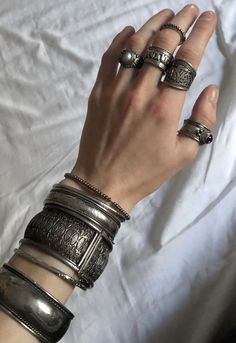 Silver jewelry Nails And Silver Rings, Dark Silver Jewelry Aesthetic, Lots Of Silver Jewelry Aesthetic, Silver Bangles Aesthetic, Maximalist Silver Jewelry, Silver Maximalist Jewelry, Maximalist Jewelry Silver, Grunge Jewelry