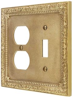 an ornate light switch cover with two outlets