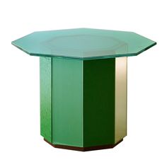 a green and gold octagonal table on a white background