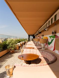 an outdoor seating area with tables and chairs