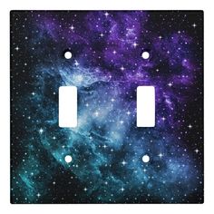 two light switch covers with purple and blue stars in the sky on black metal background