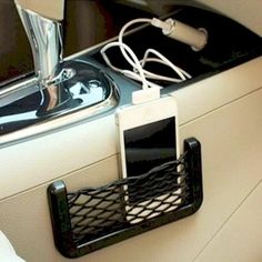 an electronic device is plugged into the back seat of a car