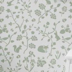 the wall paper is green and white with flowers