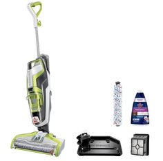 a green and white steam mop next to other cleaning supplies on a white background