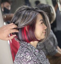 Gray Bob with Red Peekaboo Highlights Grey Hair With Pink Highlights, Peekaboo Hair Highlights, Red Peekaboo Highlights, Purple Peekaboo Highlights, Pink Peekaboo Hair, Hair Highlights Ideas, Blonde Peekaboo Highlights, Red Peekaboo, Gray Bob