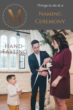 a man and woman are cutting the ribbon for a young boy