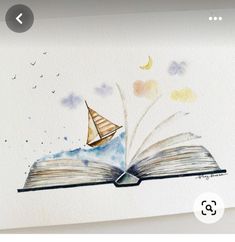 an open book with a paper boat floating out of it