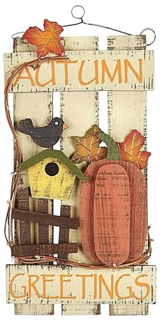 a wooden sign that says autumn with pumpkins and birds