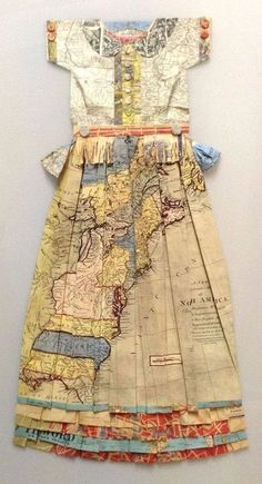 a dress made out of old maps is displayed on a white surface with blue and yellow trims