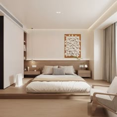 a bedroom with a large bed and white furniture