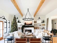 a living room filled with furniture and a fire place in the middle of a room