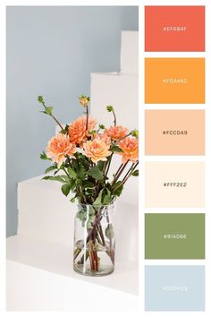 a vase filled with flowers sitting on top of a white counter next to some stairs