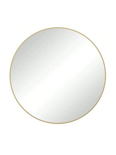 a round mirror with a gold rim on a white background and an empty space for text