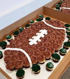 cupcakes are arranged in the shape of a football