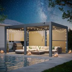 an outdoor living area is lit up at night