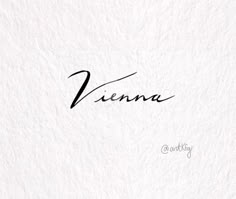 the word vienna written in cursive writing on a white paper with black ink