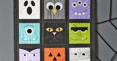 a wall hanging made to look like halloween quilts