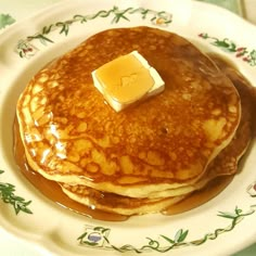 pancakes with syrup and butter on a plate