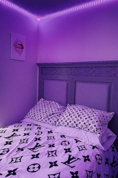 a bedroom with purple walls and black and white bedding