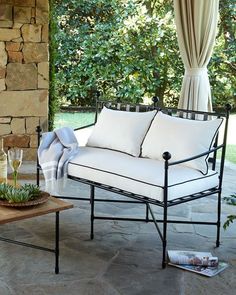 a couch and coffee table on a patio