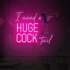 a neon sign that says i need a huge cook fail with a cocktail in it