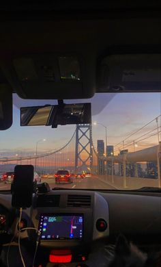 the view from inside a vehicle driving over a bridge