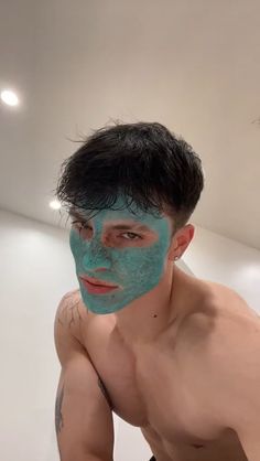 a man with blue face paint on his face